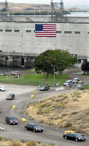 (AP: Ken Lambert) President Bush's motorcade departs after a tour of the Ice Harbor Lock and Dam, Friday, Aug. 22, 2003, in Burbank, Wash.