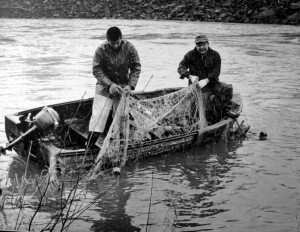 In this 1960's photo, Billy Frank Jr., left, fishes on the Nisqually River near Olympia, Wash., with his half brother Don McCloud. Frank, a Nisqually tribal elder, was arrested dozens of times while trying to assert his native fishing rights during the Fish Wars of the 1960s and '70s,. (AP Photo/Courtesy Northwest Indian Fisheries Commission)