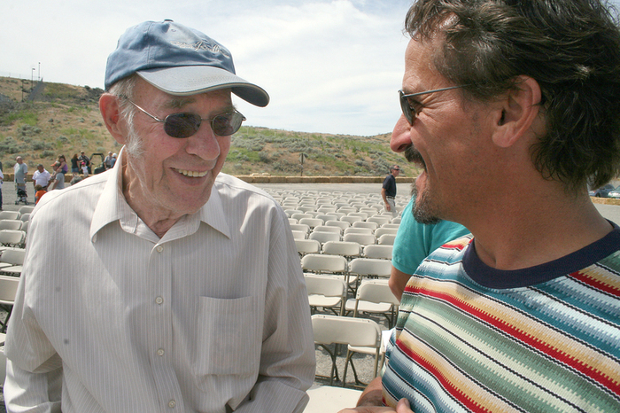Bob Kress, left, shares a laugh with Scott Levy during a celebration of the 50th anniversary of completion of construction at Ice Harbor Dam. A project engineer during construction, Kress helped oversee installation of the dam's turbines and other equipment. (Andy Porter photo)