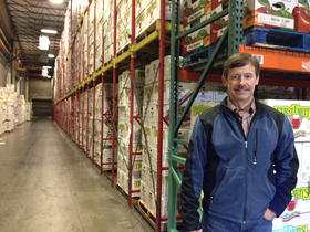Jim Hazen of Broetje Orchards is trying not to stress out as boxes pile high in the Prescott, Washinton company's cold storage facility. He estimates they have about a small Safeways worth of fruit for export held up by port delays. (photo Anna King)