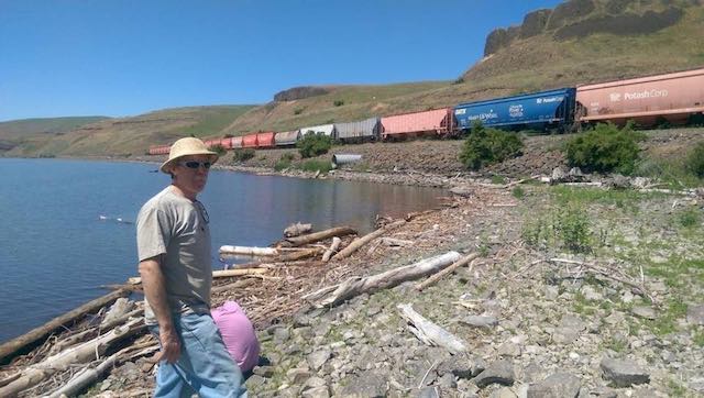 Wheat farmer Bryan Jones on the Snake River. He says river shipping is cheaper than rail and trucking for him. But if more rail is built to offset the loss of the river, he supports removing four Snake River dams in Washington state. (Rocky Barker photo)