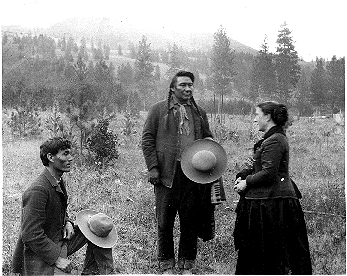 An 1889 photograph of Chief Joseph speaking to ethnologist Alice Cunningham Fletcher and her interpreter James Stuart.