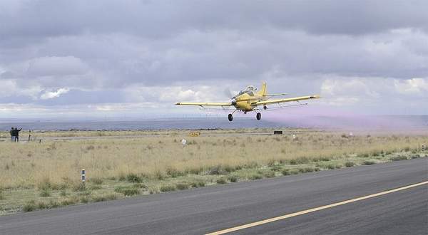 An aerial applicator makes a pass in this file photo. The Environmental Protection Agency has released an online map that helps farmers and applicators determine where buffer zones are in effect for 12 commonly used pesticides in California, Washington and Oregon.