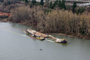 (Bruce Ely photo) The barge Davy Crockett in 2011, moored in the Columbia River in 2011 after a scrapping operation failed.