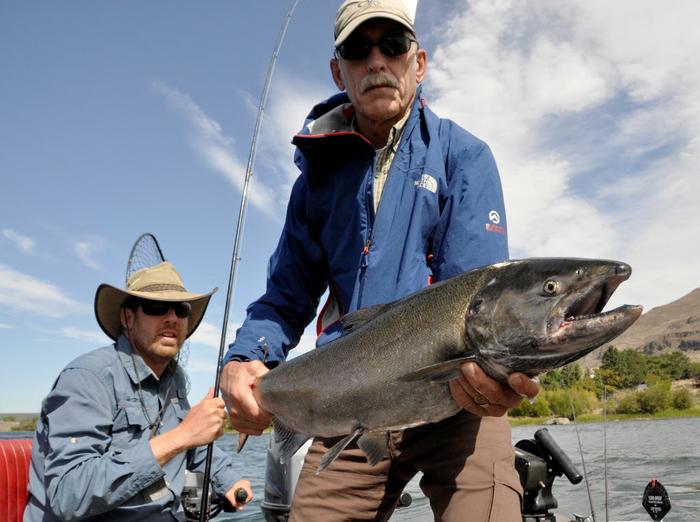 David Moershel of Spokane holds a fall chinook he caught while angling with Spokane salmon fishing guide Dave Grove of Captain Dave's Guide Service on the Columbia River. (Rich Landers Sept. 8, 2014 photo)