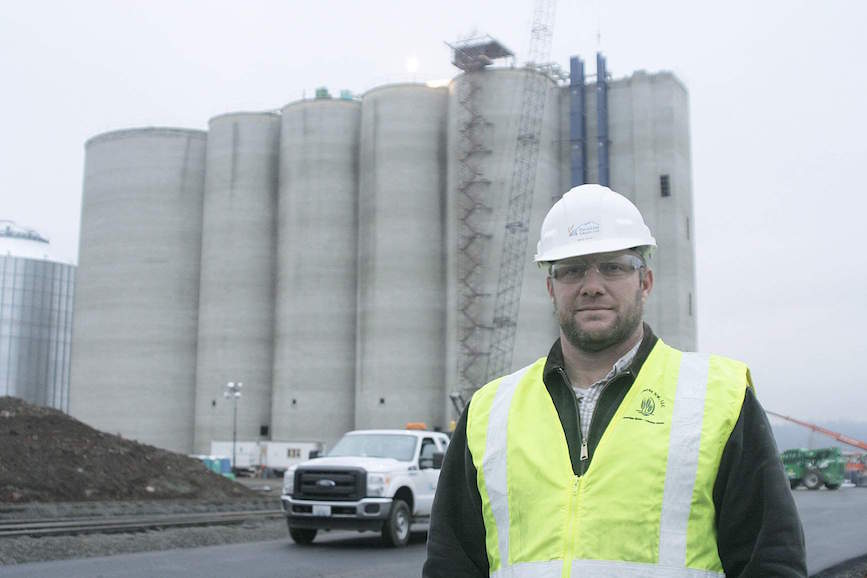HighLine Grain terminal superindendent Brad Wiley stands outside the facility during construction November 6 near Four Lakes, Washington.  The terminal is slated to open in late January.