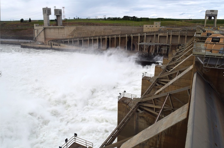 The spillway of the Ice Harbor Dam on Wednesday with the fish ladder in the back.