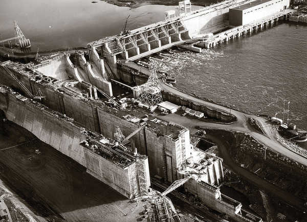Heavy equipment works on the Franklin County side of the Ice Harbor Dam project on the Snake River nearing the completion of the massive concrete structure in 1962. A 50th anniversary celebration and dam open house is scheduled for June 16. (ACOE photo)