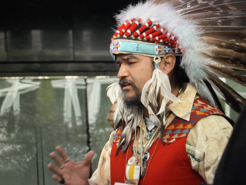 Palouse Tribal Leader Jesse Nightwalker often wore traditional clothing when speaking about dam removal to remind his audience of the promises made to his mother and her family when their were displaced by the construction of Ice Harbor Dam.