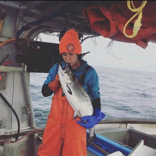 Local fisherman Kat Murphy kisses the first Chinook caught on her boat 'The Grace' in 2018.