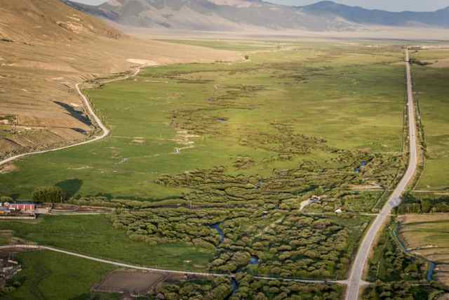 This June 26, 2015 aerial photo shows Karl Tyler's 5,000 acres of ranchland near Leadore, Idaho. The Bonneville Power Administration recently signed a conservation easement with Tyler on the property; protecting key spawning areas for threatened salmon and steelhead. (Ilona McCarty Photo) 