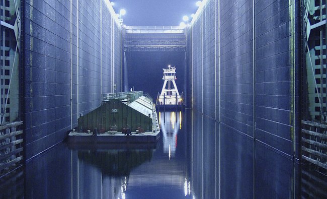 A wheat barge awaits a nighttime lift in a Lower Snake River lock.