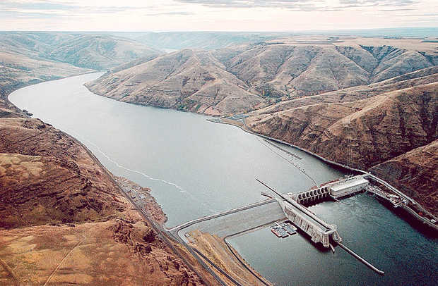 Lower Granite Dam impounds reservoir water nearly forty miles all the way to the Idaho border.