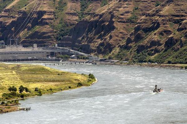 A boat makes its way up the Snake River toward the Lower Granite Dam in this June 6, 2018 photo. (Pete Caster/Lewiston Tribune)