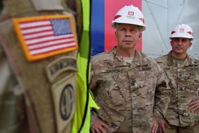 Lt. Gen. Todd Semonite, 54th chief of engineers and commander of the U.S. Army Corps of Engineers, center, and Col. John Lloyd, commander of Task Force Power, receive a briefing in Puerto Rico during the Corps’ response to Hurricane Maria in October of 2017. (U.S. Army Corps Engineers photo)