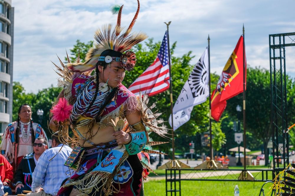 A member of the Nez Perce Tribe dances at a rally outside the U.S. Capitol on July 14, 2022, organized by Northwest tribes in support of breaching the Lower Snake River dams to help restore salmon runs. (Orion Donovan-Smith, The Spokesman-Review)