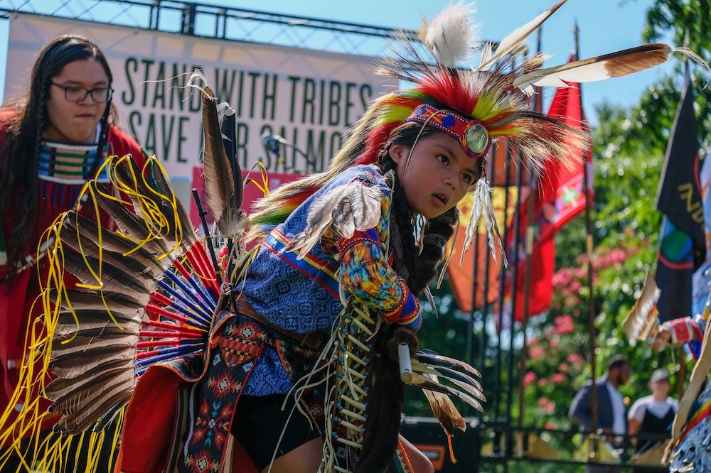 Members of the Nez Perce Tribe dance at a rally outside the U.S. Capitol on July 14, 2022, organized by Northwest tribes in support of breaching the Lower Snake River dams to help restore salmon runs. (Orion Donovan-Smith, The Spokesman-Review)