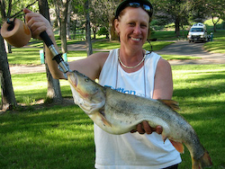 (Photo by Brian Ramsden) Pamela Ramsden of Deer Park, WA, caught this Washington State record northern pikeminnow in the Snake River on May 16, 2008. The 26.25-inch-long fish was officially weighed at 7.91 pounds.