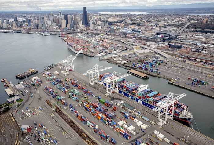 The container ship Benjamin Franklin calls at Terminal 18 of the Port of Seattle.  West Coast container port operators and the union representing longshoremen have agreed to hold further talks to extend their contract and avoid a work slowdown.