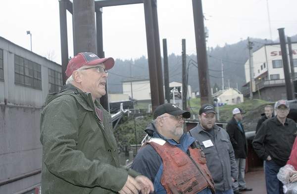 Rob Rich, vice president of marine servies for Shaver Transportation, addresses a Washington Grain Commission export tour on board a tugboat Nov. 30 in Portland.