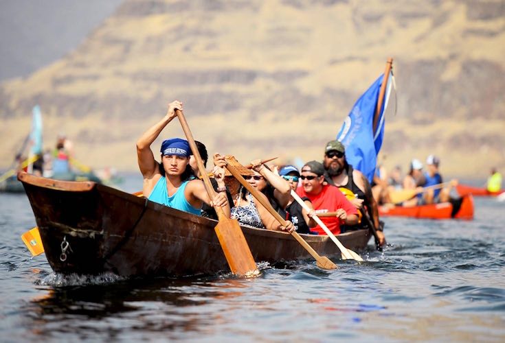 Nez Perce Tribal members paddle down the river Saturday afternoon at the 'Free the Snake Flotilla' (Rachel Sun photo)