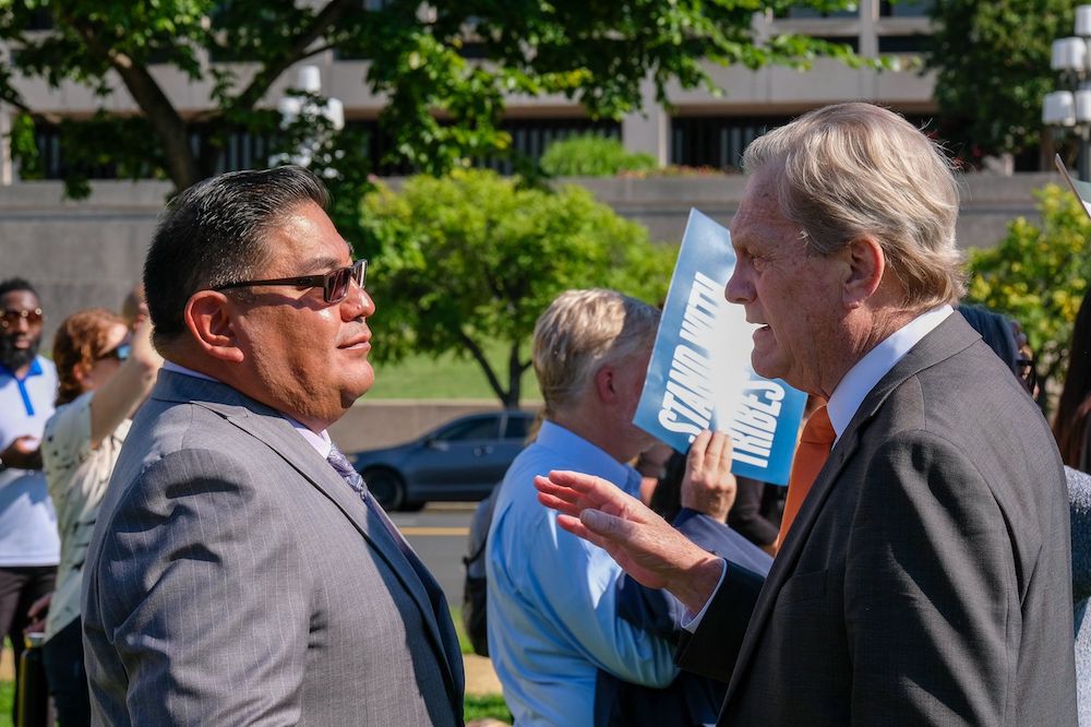 Shannon Wheeler, vice chairman of the Nez Perce Tribal Executive Committee, talks with Rep. Mike Simpson, R-Idaho, at a rally outside the U.S. Capitol on July 14, 2022, organized by Northwest tribes in support of breaching the Lower Snake River dams to help restore salmon runs. (Orion Donovan-Smith, The Spokesman-Review)