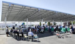 About 80 people gather Wednesday for a dedication ceremony of the new Franklin PUD community solar carport structure at 1411 W. Clark St. in Pasco.