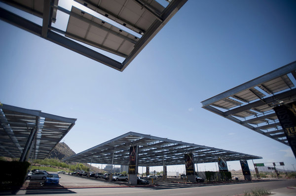 Solar photovoltaic energy produces clean energy while at the same time providing shade to cars in a parking lot.