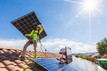 Solar goes up on a rooftop in Nevada, bringing benefits to all electricity customers.