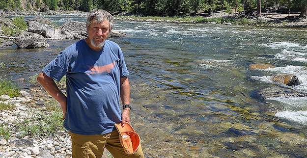 Former Idaho Fish and Game biologist Steve Pettit's efforts to save Snake River salmon and steelhead have made him a legend among conservationists and anglers. Here, Pettit stands on the banks of the Selway River, a tributary of the Snake. (photo by Jeremy P. Jacobs/E&E News)