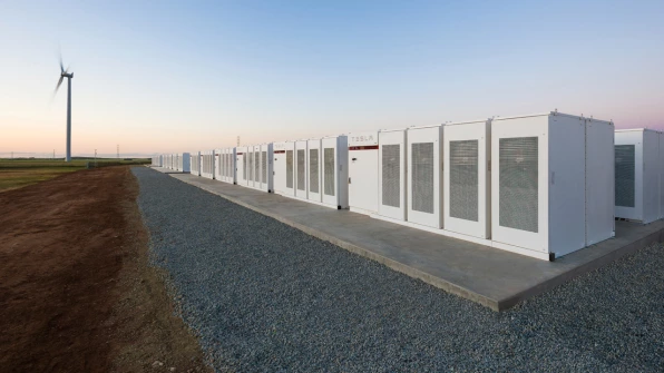 In Australia, the world's largest lithium-ion battery, installed by Tesla over an area the size of a football field at a wind farm, is saving consumers millions of dollars by making the grid more reliable. (photo: Tesla)