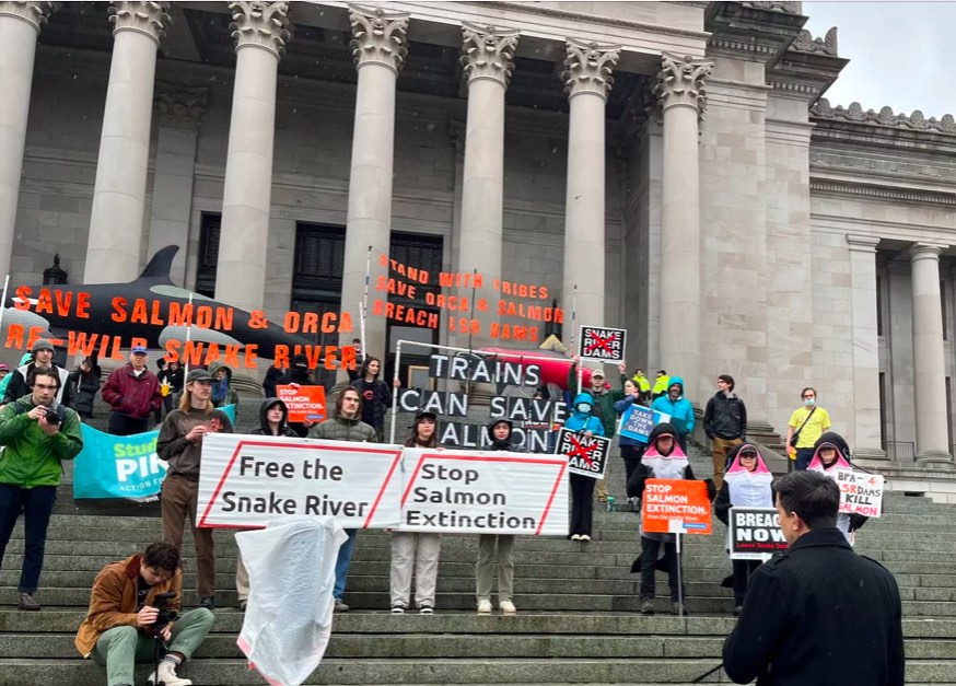 Rep. Alex Ramel, D-Bellingham, addresses the crowd of demonstrators on the steps of the Capitol building. (Elena Perry / The Spokesman-Review)