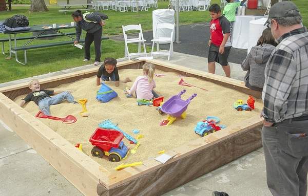 Children joined the fun, playing in a wheat box at the Snake River Family Festival.