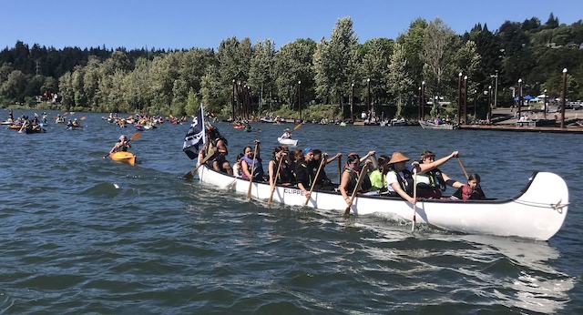 Dozens of boaters, kayakers and canoe paddlers launched Saturday morning at Willamette Park to protest the continued operation of four dams on the lower Snake River. Pressure is mounting to breach the dams and help beleaguered salmon and steelhead runs. (photo Bill Monroe)