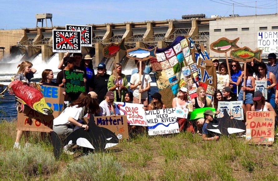 Members of the Youth Salmon Protectors pose infront of Ice Harbor Dam during a protest this summer.  The group will hold a Youth Salmon Celebration at Hells Gate State Park on Saturday. (Scout Alford photo)
