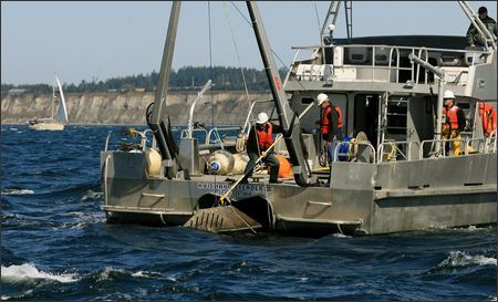 A crew from Evans Hamilton, a nationwide oceanographic consulting firm, on Wednesday removes equipment that measures tidal currents from Puget Sound in Admiralty Inlet off Whidbey Island.