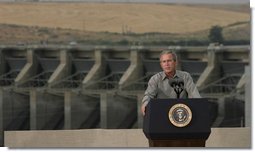 President George W. Bush discusses salmon restoration from Ice Harbor Locks and Dam in Burbank, Wash., Friday, August 22, 2003. "I was pleased to see the incredible care that goes in to protecting the salmon that journey up the river. It's an important message to send to people, it seems like to me, that a flourishing salmon population is a vital part of the vibrancy of this incredibly beautiful part of our country," said the President in his remarks about his tour of the facility. White House photo by Paul Morse.