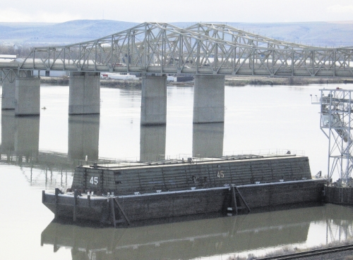(Matthew Weaver) Tri Cities Grain in Pasco, Wash., was ready to load this 90,000-bushel barge from Tidewater Barge Lines, located on the Snake River near the Snake River Bridge on March 18, in anticipation of the Columbia-Snake River system's reopening.