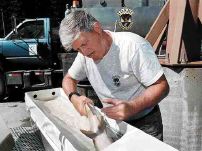 Bob Schloss, an Idaho Fish & Game biologist with the Clearwater Fish Hatchery, injects antibiotics into a chinook salmon retrieved from a trap on the Crooked River in Central Idaho