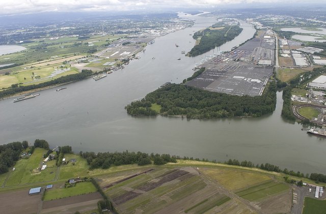 (Erin Starkebaum) The Columbia River flows past the confluence of the Willamette River in this aerial view on Friday. 