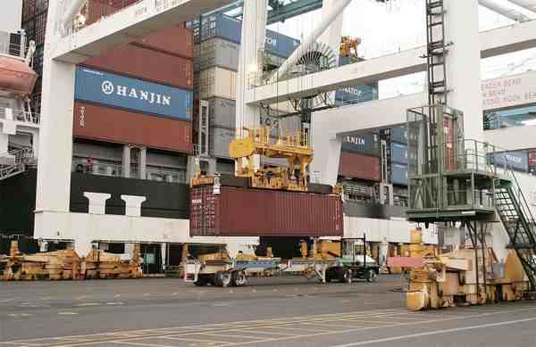 (Mateusz Perkowski photo) Cargo containers are shown being loaded on ships at the Port of Portland 