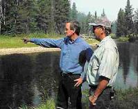 Idaho Senator Mike Crapo talks with Idaho Fish & Game Fisheries Biologist Don Anderson Tuesday about the fire's effect on salmon runs along the Secesh River north of McCall.  The Secesh River borders the fire lines of the Burgdorf fire.