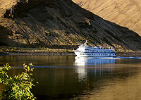 A cruise ship glides along the Snake River. The Army Corps of Engineers says the sediment buildup may be slowing.