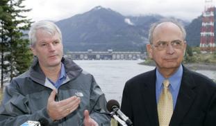 U.S. Reps. Doc Hastings, R-Wash, right, and Brian Baird, D-Wash., stand near Bonneville Dam and the Columbia River in North Bonneville, Wash., Monday, Oct. 16, 2006, as they announce a new legislative initiative aimed at protecting endangered Columbia River salmon and steelhead from sea lion predation. Fishery officials have tried just about everything to keep sea lions from munching on threatened