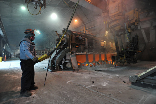 (Philip A. Dwyer) Worker Kevin Daniels works on a recently started aluminum smelter pot on potline B at the Alcoa Intalco aluminum smelter west of Ferndale, Tuesday afternoon, Feb. 15, 2011. Intalco has also hired 60 more people.