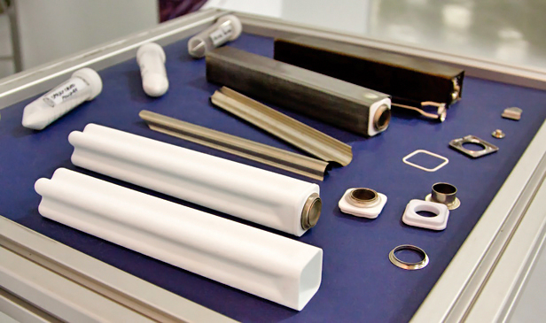 (Kevin Bullis) Battery innards: A display at GE's new battery factory shows the basic components of the company's new battery cells. The white ceramic material is a solid electrolyte that's the key component to making the battery work.