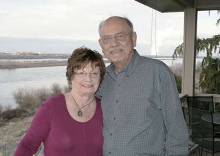 (Dan Wheat photo) Former Congressman Doc Hastings and his wife, Claire, stand on the deck of their home overlooking the Columbia River just north of Pasco, Wash., on Jan. 15, 2015.