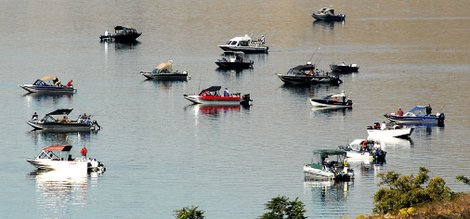 Fishing boats crowd the Clearwater River for Idaho's arriving steelhead trout.