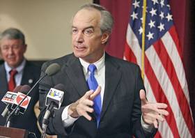 (Darin Oswald) Interior Secretary Dirk Kempthorne takes questions at a news conference before taking part in a 