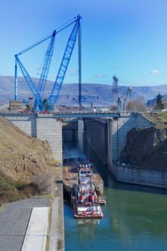 At The Dalles Dam on the Columbia River, Lampson International mobilized a Manitowoc 4100W, a Manitowoc 3900, a Grove 760E rough terrain crane and its Transi-Lift LTL-1100.'